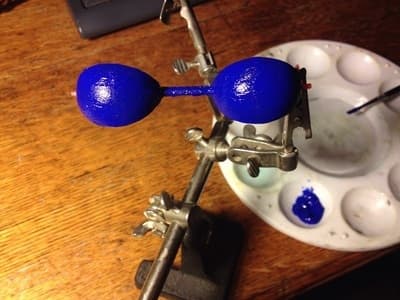 A 3D print of an eyelid for Ohbot 2.